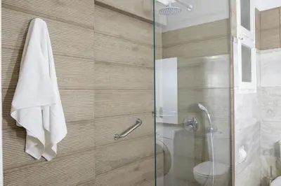 a bathroom with a glass shower with a toilet at Luxury three bedroom Apartment in Kolonaki in Athens