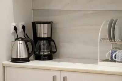 a coffee maker sitting on top of a kitchen counter at Luxury three bedroom Apartment in Kolonaki in Athens