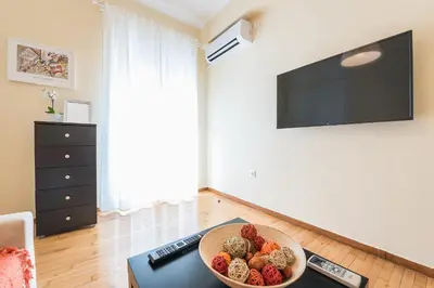 a bowl of food on a table in a living room at Heart of the City in Athens