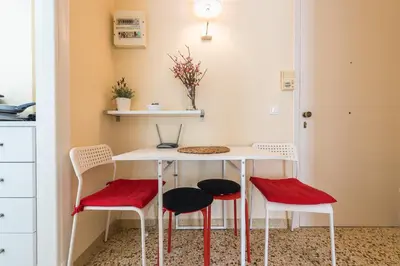a kitchen with a table and four chairs at Heart of the City in Athens