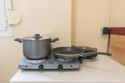 a pot on top of a stove in a kitchen at Heart of the City in Athens