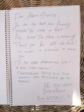a note with handwriting on it on a notebook at Sunny Studio in Koropíon