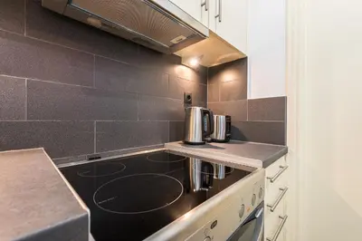 a kitchen with a sink and a counter top at Acropolis foothill in Athens
