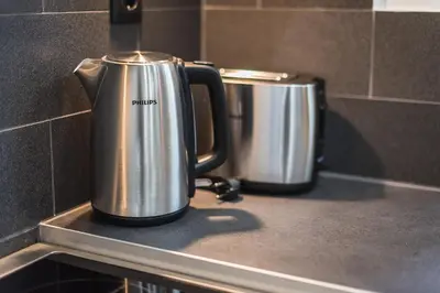 two stainless steel coffee pots sitting on a kitchen counter at Acropolis foothill in Athens