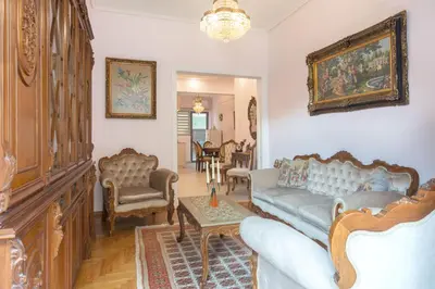 a living room with a couch and a table at Lovely Apartment in Athens in Athens