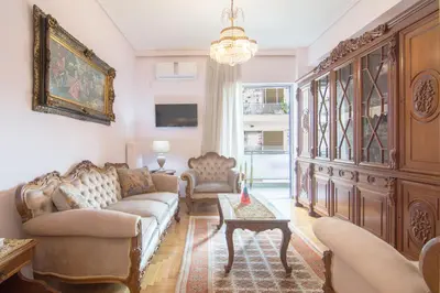 a living room with a couch and a table at Lovely Apartment in Athens in Athens