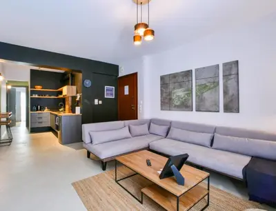 a living room with a couch and a coffee table at Soho Apartments by Olala Homes in Athens