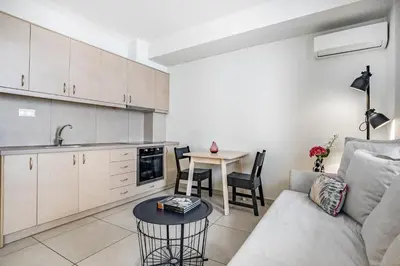 a living room with a couch and a table at Supreme C1 Apartment in Syntagma in Athens