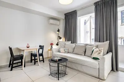 a living room with a couch and a table at Supreme C1 Apartment in Syntagma in Athens
