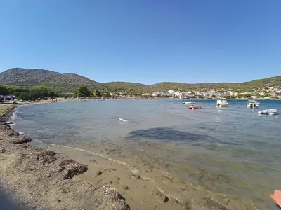 a view of a beach with boats in the water at Finikas Rooms in Agia Marina Aegina