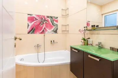 a bathroom with a tub and a sink at Iris apartment acropolis terrace view in Athens
