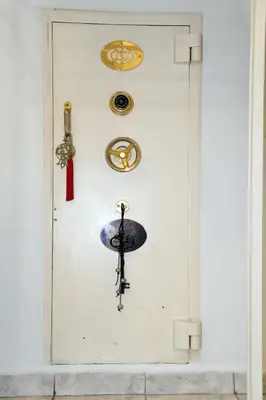 a white door with decorations on a white wall at Best of Athens Apartment in Athens