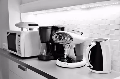 a kitchen counter with a coffee maker and a blender at Best of Athens Apartment in Athens