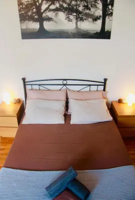 a bedroom with a large bed with two pillows at Penthouse with Sea View in Athens