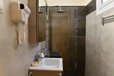 a bathroom with a sink and a shower at Acro&Polis in Athens
