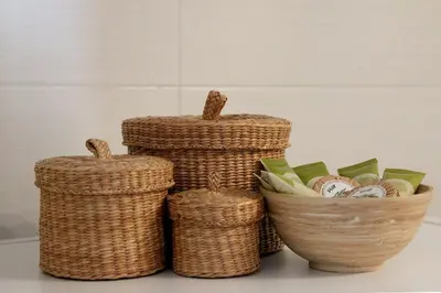 three wicker baskets sitting next to a bowl of money at Athens Vintage Apartment - Ilisia in Athens