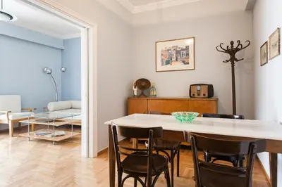 a dining room with a table and chairs at Athens Vintage Apartment - Ilisia in Athens