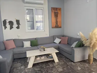 a living room with a couch and a coffee table at Paloma in Athens