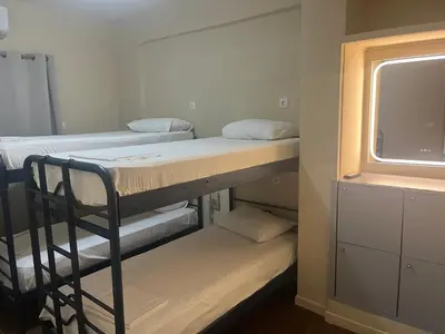 a room with two bunk beds and a window at Paloma in Athens