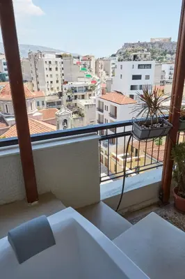 a balcony with a view of a city at Mosaics Astonishing Acropolis view Aprtm in Athens
