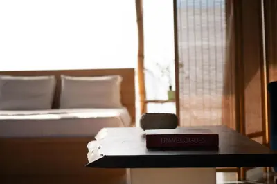 a book on a table in a room with a bed at 5* Penthouse Acropoli View Loft in Athens