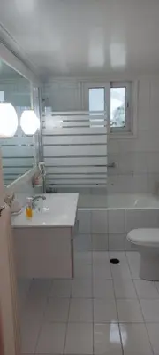 a bathroom with a tub and a sink and a toilet at Casa Oliver in Athens