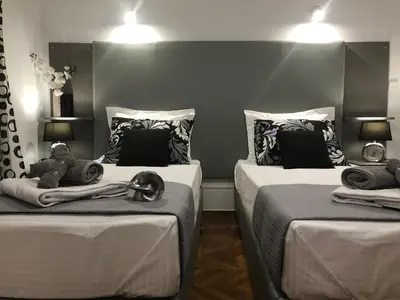 two beds with towels and stuffed animals on them at Athenaeum Acropolis Residence 1min to Museum in Athens