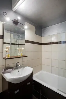 a bathroom with a sink and a bath tub at Athenaeum Acropolis Residence 1min to Museum in Athens