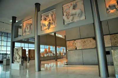 a museum with art on the walls and columns at Elegant Acropolis in Athens