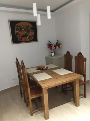 a dining room with a wooden table and chairs at Elegant Acropolis in Athens