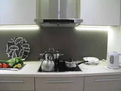 a kitchen with a stove with pots and pans on it at Elegant Acropolis in Athens