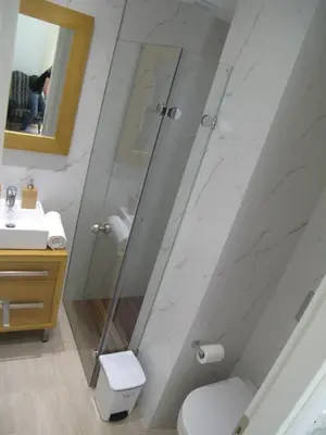 a bathroom with a shower and a toilet and a sink at Elegant Acropolis in Athens