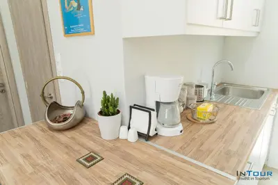 a kitchen counter with a mixer and other kitchen items on it at Art point under Acropolis in Athens