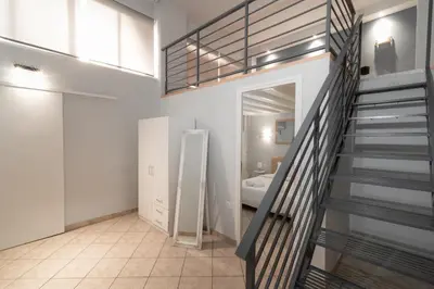 a staircase in a room with a bathroom at Spacious apartment-600m from the subway in Athens