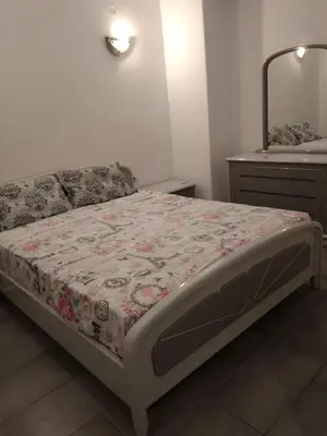 a bedroom with a bed and a dresser at Yiannis Kalimarmaro Studio,Athens Center in Athens