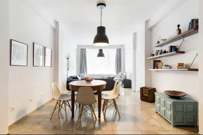 a dining room with a table and chairs at Feels like home with luxury details in Athens