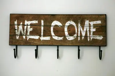 a sign with the words we love hanging on a wall at Feels like home with luxury details in Athens