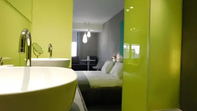 a bathroom with a bed and a tub and a sink at 101 Adrianou Apartments in Athens