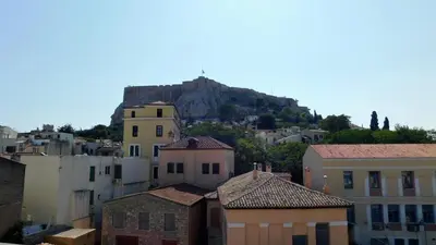 a view of a city with a mountain in the background at 101 Adrianou Apartments in Athens