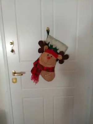a door with a christmas ornament hanging on it at Annadel Flat in Athens