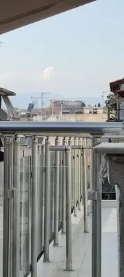 a row of columns on top of a building at Annadel Flat in Athens