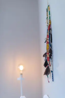 a bunch of ties hanging on a wall at ABA Junior Apartment Veikou street in Athens