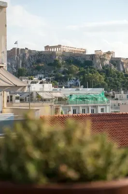 a view of the acropolis of athens from the roofs of buildings at Ariadne's Penthouse in Central Athens in Athens