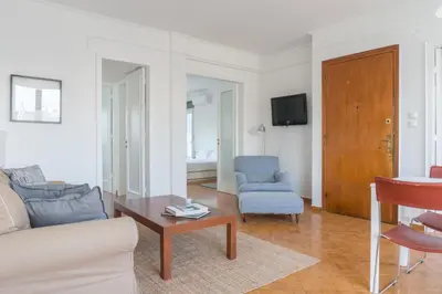 a living room with a couch and a table at Ariadne's Penthouse in Central Athens in Athens