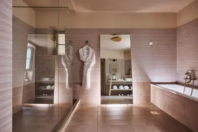 a bathroom with a tub and a sink at Bohemian Suites Athens - Maison Hotel Adults Only in Athens