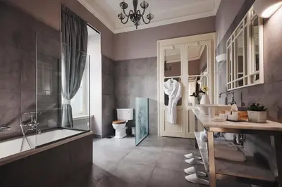 a bathroom with a tub and a sink and a toilet at Bohemian Suites Athens - Maison Hotel Adults Only in Athens