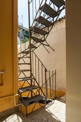 a set of stairs next to a building at Stylish, Basement Studio with Roof Garden Access - EP9B in Athens