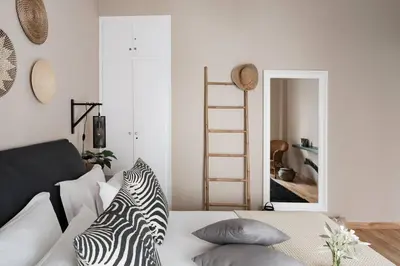 a room with a bed with a zebra pillow on it at Your 