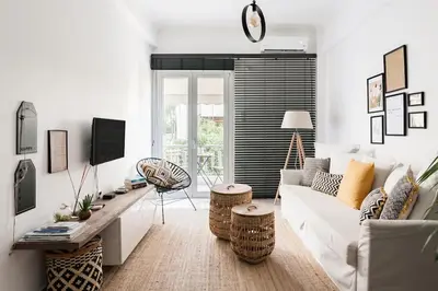 a living room with a white couch and a table at Your 