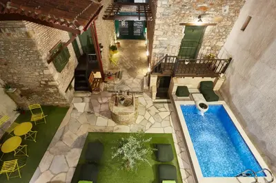 an overhead view of a pool in a house at Athenian Residences in Athens